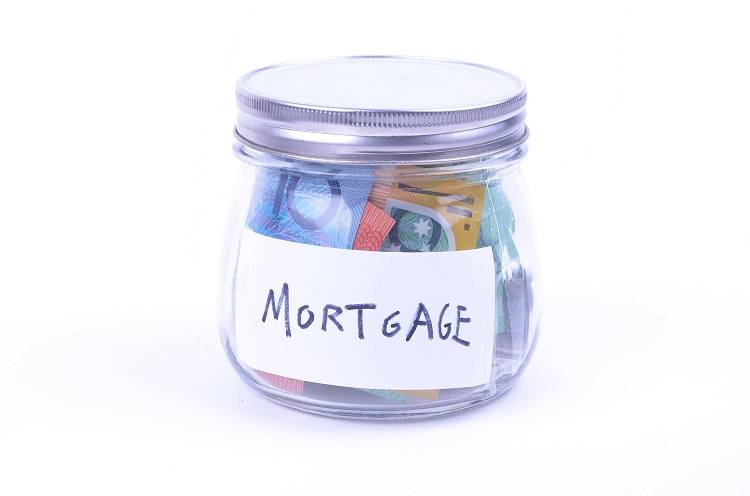 A jar filled with Australian Bills labelled "Mortgage"