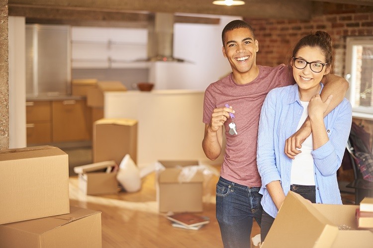 a couple packing up to move into their new home