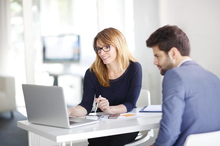 A mortgage broker talks to a client